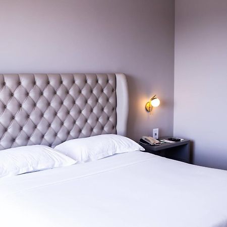 Ouro Minas Hotel Belo Horizonte, Dolce By Wyndham 외부 사진 A bedroom at the hotel